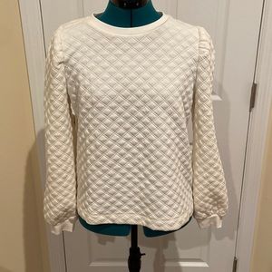 This is an off white sweater from Loft with a quilted pattern on it